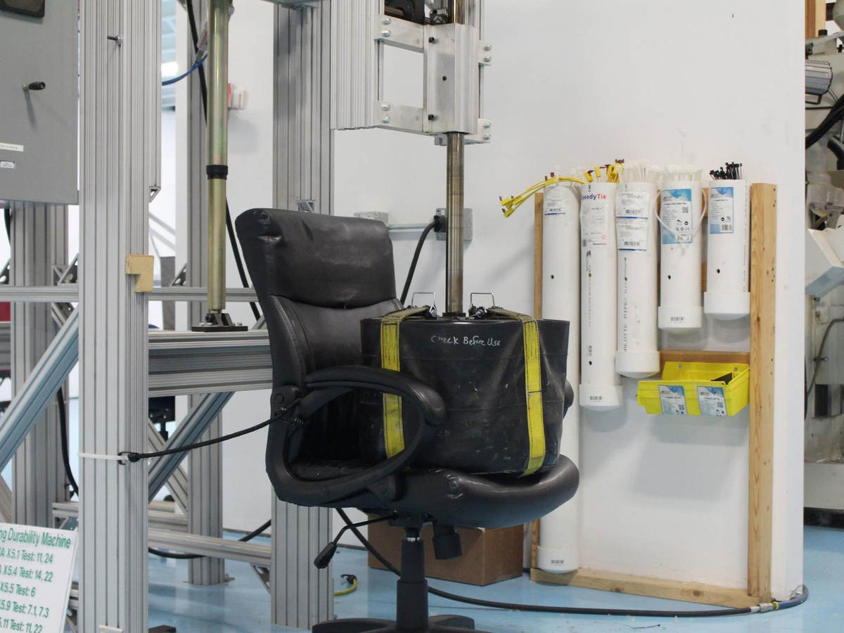 A weight sits on an office chair as part of testing